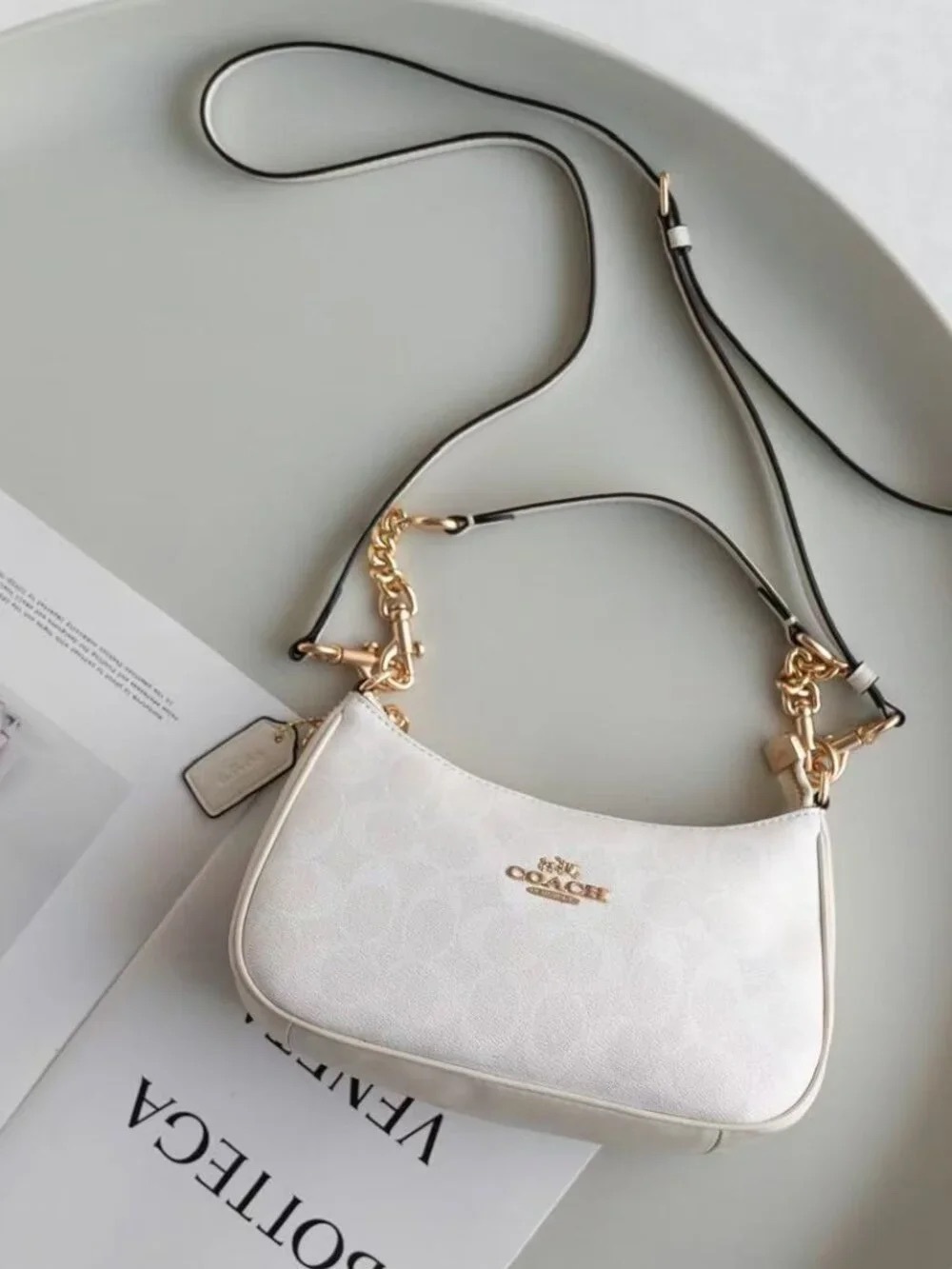 Coach White Leather Shoulder Bag with Gold Hardware and Black-Trim Strap